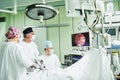 Surgeons team hands during laparoscopic abdominal operation in child surgery