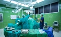 Surgeons team working with Monitoring of patient in surgical operating room. Royalty Free Stock Photo