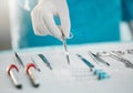 Surgery equipment, table and hands with scissors for a medical procedure in theater. Closeup, hospital and a doctor or