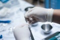 Close up of surgeons hands with scalpel at operation in operating room at hospital Royalty Free Stock Photo