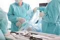 Surgery through small holes in the abdominal cavity. A team of surgeons. Laparoscopic instruments in the hands of a surgeon Royalty Free Stock Photo