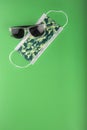 Surgical camo facemask and sunglasses Royalty Free Stock Photo