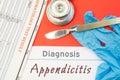 Surgical diagnosis of Appendicitis. Surgical medical instrument scalpel, latex gloves, blood test analysis lie close beside text i