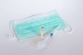 Surgical ear-loop mask and injection syringe