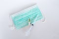 Surgical ear-loop mask and injection syringe