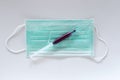 Surgical ear-loop mask and injection syringe