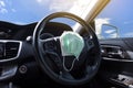 Surgical face mask placed on steering wheel