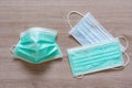 Surgical face masks for preventing covid-19 disease on wooden background Royalty Free Stock Photo