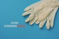 Surgical gloves and text stop coronavirus