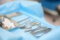 Surgical instruments are lying on a blue sterile table in the operating room. Steel medical instruments that are used during Royalty Free Stock Photo