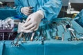 Surgical instruments in the operating room, the surgeon`s assistant arranges them on a sterile takani. The concept of Royalty Free Stock Photo
