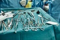 Surgical instruments in the operating room, the surgeon`s assistant arranges them on a sterile takani. The concept of Royalty Free Stock Photo