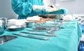 Surgical instruments, surgery, placed on a sterile green cloth