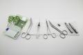 Surgical instruments, syringe, ammunitions and money Royalty Free Stock Photo