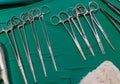 Surgical instruments and tools including needle, gauze, scissor arranged on a table for a surgery in an operation room Royalty Free Stock Photo