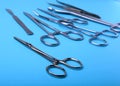 Surgical instruments and tools including scalpels, forceps and tweezers arranged on a table for a surgery. Royalty Free Stock Photo