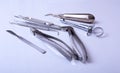 Surgical instruments and tools including scalpels, forceps tweezers arranged on a table for surgery Royalty Free Stock Photo