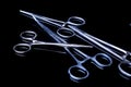 Surgical instruments and tools including scalpels, forceps and tweezers on black mirror background. Royalty Free Stock Photo