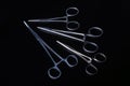 Surgical instruments and tools including scalpels, forceps and tweezers on black mirror background. Royalty Free Stock Photo