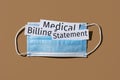 Surgical mask and text medical billing statement