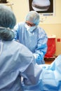 Surgical Team Working In Operating Theatre Royalty Free Stock Photo