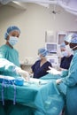 Surgical Team Working On Patient In Hospital Operating Theatre Royalty Free Stock Photo