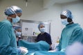 Surgical Team Working On Patient In Hospital Operating Theatre Royalty Free Stock Photo