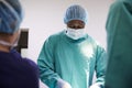 Surgical Team Working On Patient In Hospital Operating Theatre Royalty Free Stock Photo