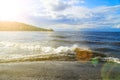 Surging wave on the Kyiv sea reservoir, water reflection, foam and sun beam