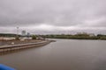 Surgut, Russia, 12 Griboyedov Street, May 11, 2022. Modern buildings and view of the embankment of the Ob river