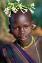 Suri girl with flowers Royalty Free Stock Photo