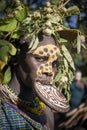 Women of the Suri tribe with painted faces and a large lip plate. Ethiopia, Omo Valley