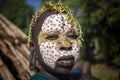Suri women with painted faces prepare for a wedding ceremony. Ethiopia, Omo Valley