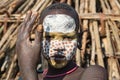 Suri women with painted faces prepare for a wedding ceremony. Ethiopia, Omo Valley