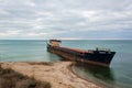 Surov dry cargo ship grounded in the Black Sea. Abandoned rusty shipwrecked off the coast of Russia.