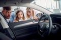 Surpised family watching new car