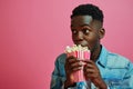 Surprise African Yearold Man Eats Popcorn On Pastel Background Royalty Free Stock Photo