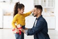 Surprise For Daddy. Little Girl Greeting Dad With Father's Day At Home Royalty Free Stock Photo