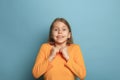 The surprise, happiness, joy, victory, success and luck. Teen girl on a blue background. Facial expressions and people Royalty Free Stock Photo