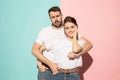 Wow. Doubtful pensive couple with thoughtful expression making choice against pink background Royalty Free Stock Photo