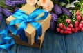 Surprise gift box with blue summer with a bouquet of roses