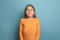 The surprise, happiness, joy, victory, success and luck. Teen girl on a blue background. Facial expressions and people Royalty Free Stock Photo