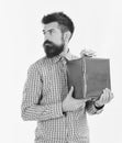 Surprise and holiday gift concept. Man with beard and curious face looks aside isolated on white background. Macho with Royalty Free Stock Photo