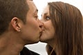 Surprise Kiss Young Couple Royalty Free Stock Photo