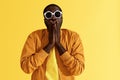 Surprise. Shocked man in fashion sunglasses on yellow background Royalty Free Stock Photo