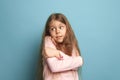 The surprise. Teen girl on a blue background. Facial expressions and people emotions concept Royalty Free Stock Photo