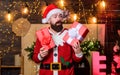Surprise. winter shopping sales. Cheerful elf. bearded man santa hat. bearded santa deliver presents. Christmas shopping Royalty Free Stock Photo
