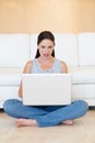 Surprise, woman and sitting with laptop on floor for good news or social media in living room at home. Shocked female Royalty Free Stock Photo