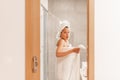 Surprised woman caught unawares in bathroom after taking a shower Royalty Free Stock Photo