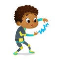 Surprised African-American Boy wearing colorful costume of superhero playing with lightning, isolated on white